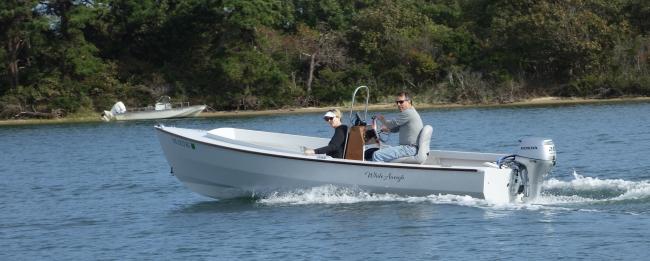 18' Port Townsend Skiff, underway port side view
