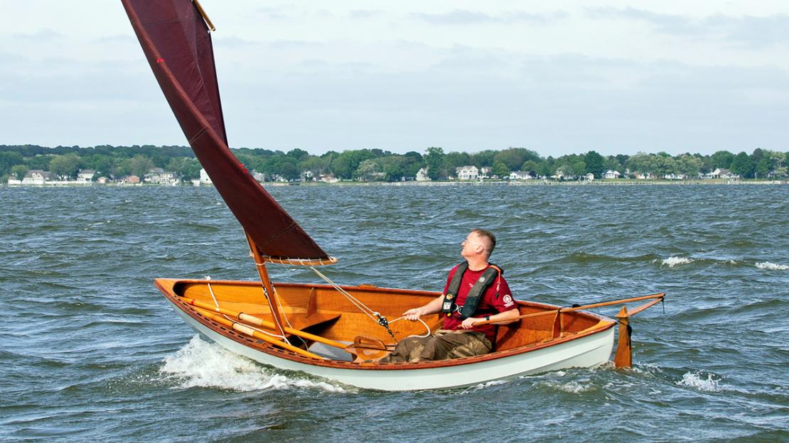 John Harris at the helm of a Skerry Skiff.