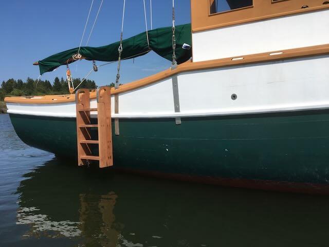 30' 1994 Bryan Motorsailer, starboard side view looking toward stern, ladder to water