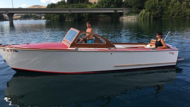1956 Essaness Craft 23' classic wooden, in water port side view