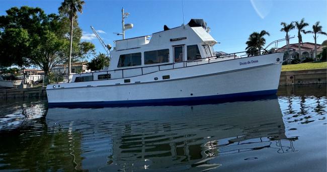 Grand Banks luxury motor yacht, in water starboard side view