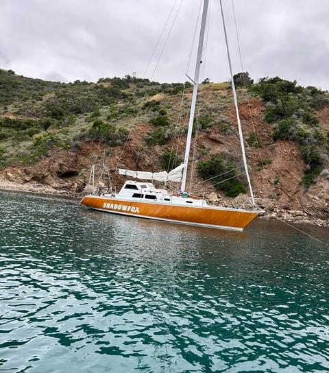 "SHADOWFOX" 31' Ocean crossing cruiser, in water, sails down starboard side view